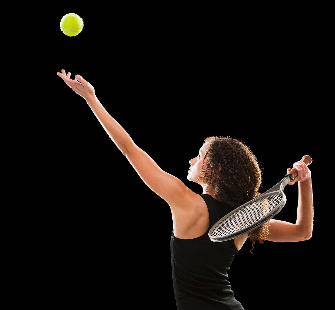 Caucasian tennis player serving the ball, Lehi, Utah, USA