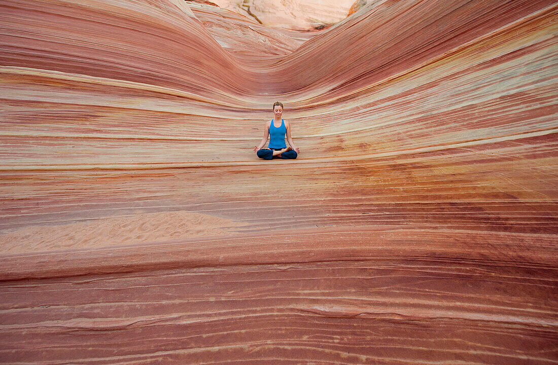Caucasian woman practicing yoga outdoors, desert, Utah, USA
