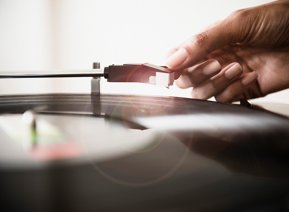 Cape Verdean woman listening to vinyl record, Jersey City, New Jersey, USA