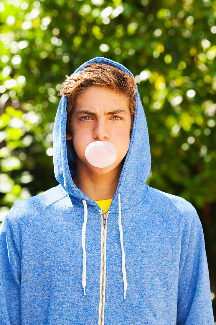 Caucasian teenager blowing bubble with gum, Sherman Oaks, CA, USA