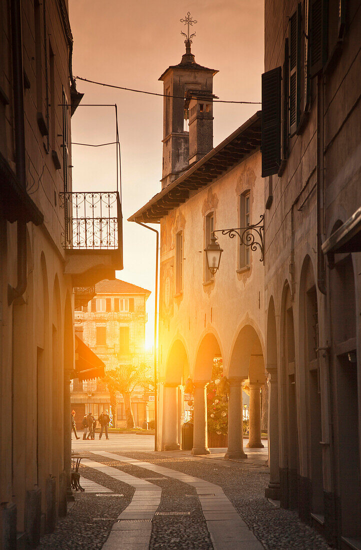 Sun shining in quaint alley, Orta San Giulio, Novara, Italy