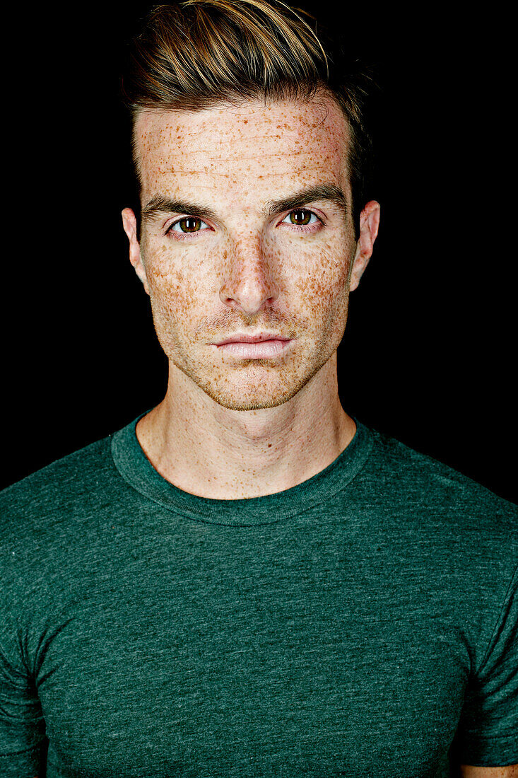 Serious Caucasian man with freckles, Los Angeles, California, USA