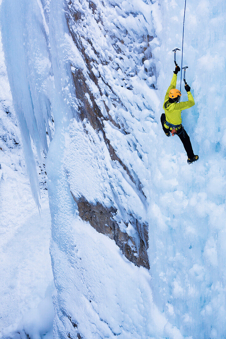 Caucasian climber scaling glacier, Ouray, CO, USA