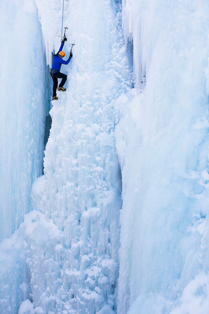 Caucasian climber scaling glacier, Ouray, CO, USA