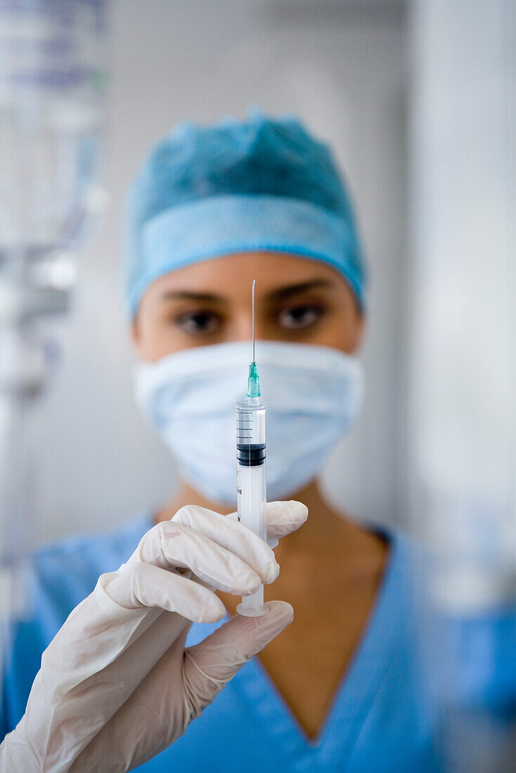 Female doctor holding syringe, Cape Town, South Africa