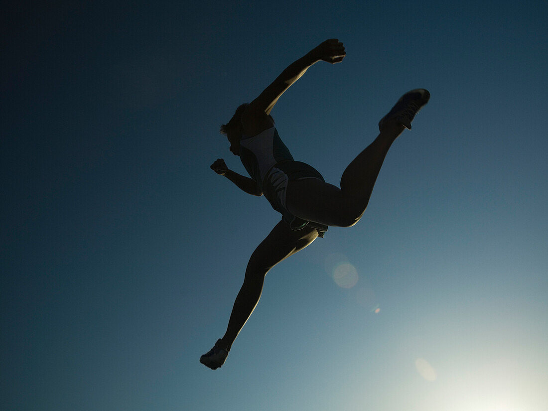 African American female athlete jumping, Salt Lake City, UT
