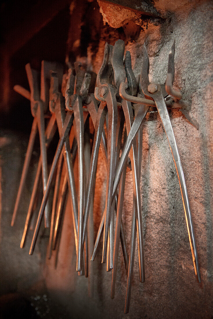 Blacksmith's tongs at a wall, Passau, Bavaria, Germany