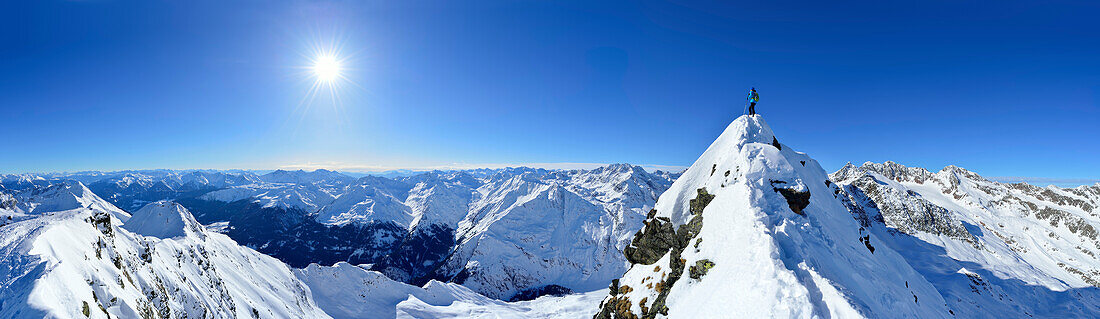 Woman standing on summit of Aeusseres Hocheck, Pflersch valley, Stubai Alps, South Tyrol, Italy