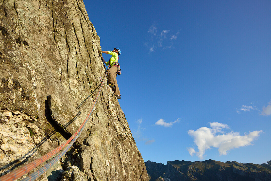 Woman climbing a rock face, Antona, Apuan Alps, Tuskany, Italy