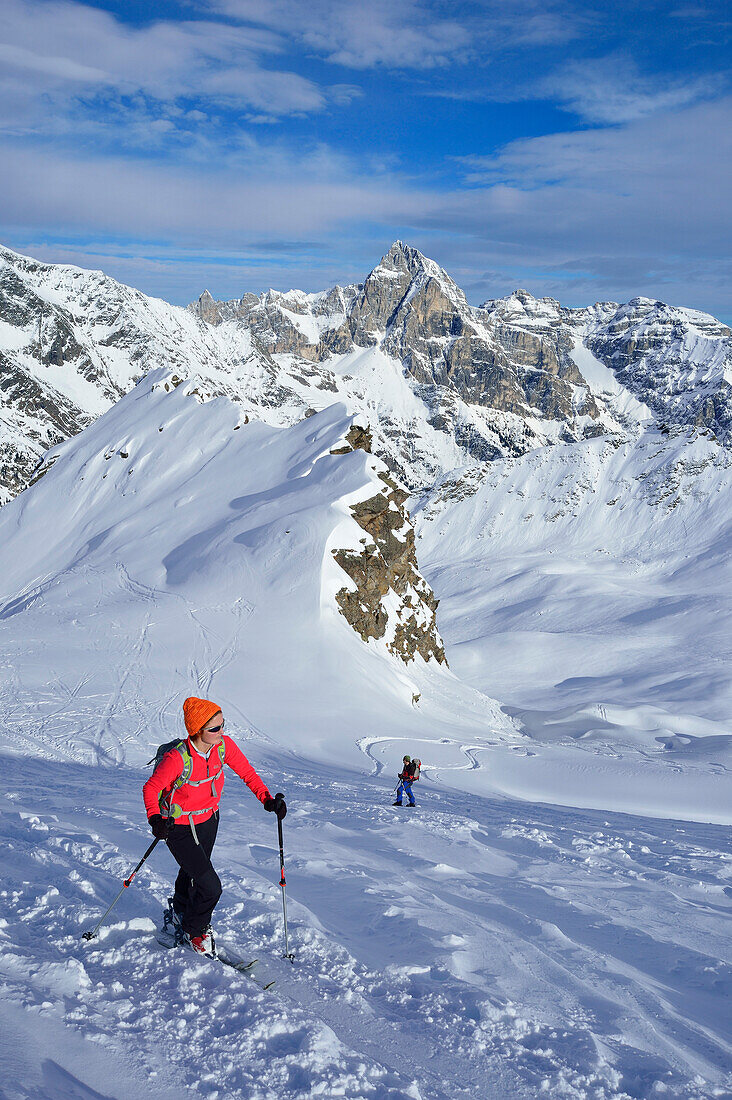 Female back-country skier ascending to Ellesspitze, Pflersch Valley, Stubai Alps, South Tyrol, Italy