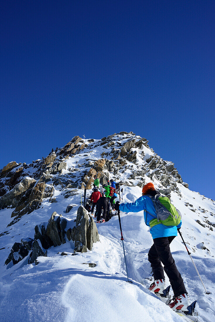 Back-country skiers ascending to Kuhscheibe, Stubai Alps, Tyrol, Austria