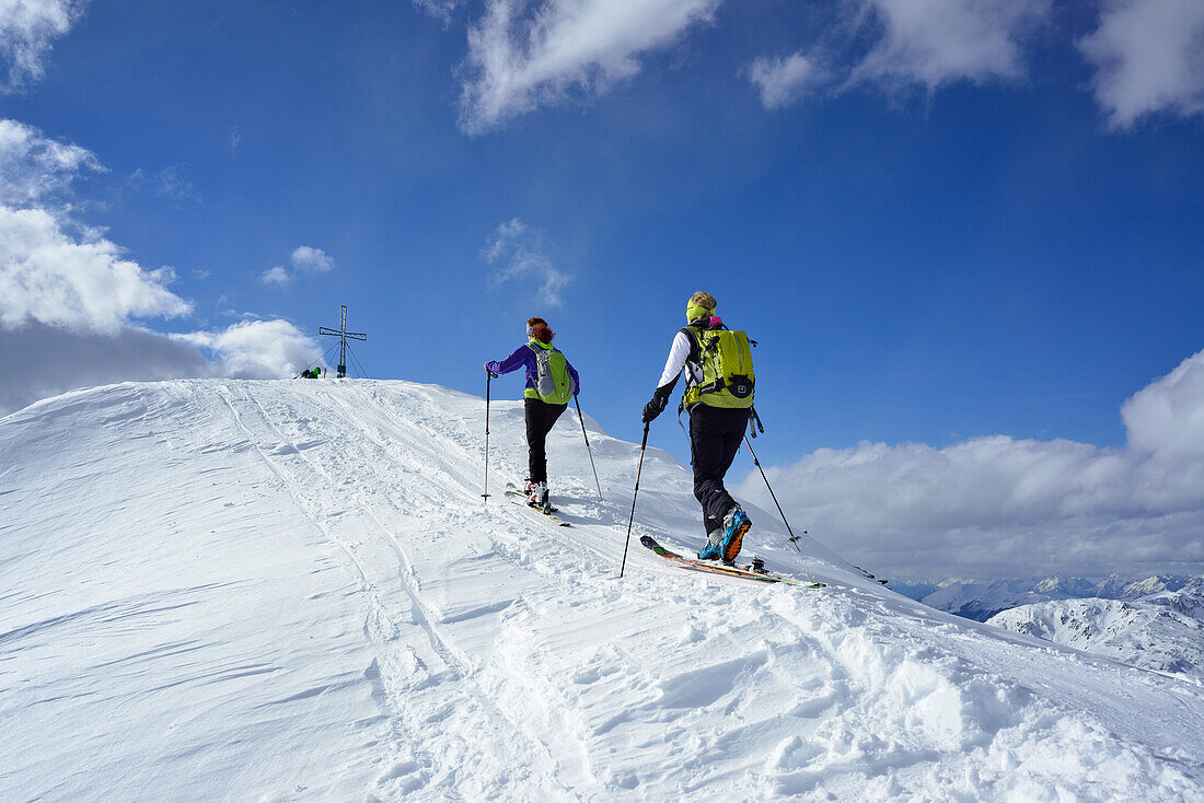Two female back-country skiers ascending to Schafsiedel, Kitzbuehel Alps, Tyrol, Austria