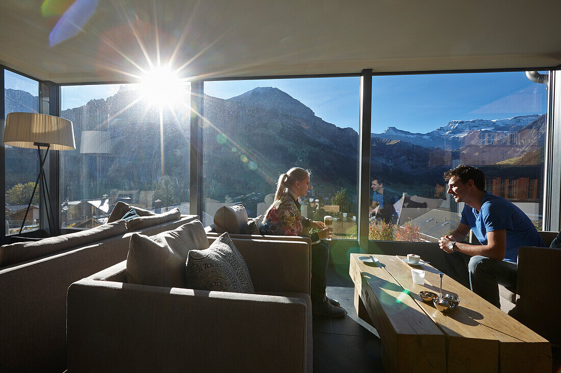 Couple drinking coffee in a hotel winter garden, Adelboden, Canton of Bern, Switzerland