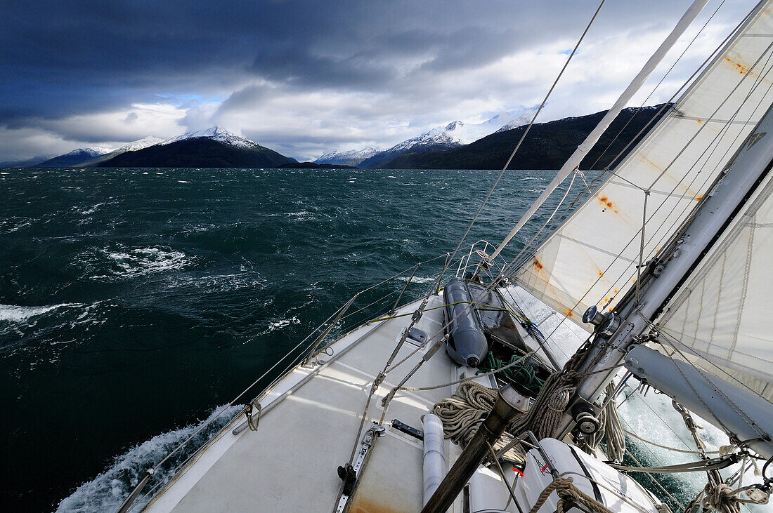Sailing boat passing Beagle Channel, Tierra del Fuego, Chile