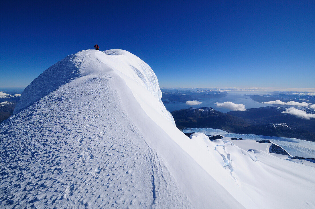 Two mountaineers on the west summit of Monte Sarmiento, Cordillera Darwin, Tierra del Fuego, Chile