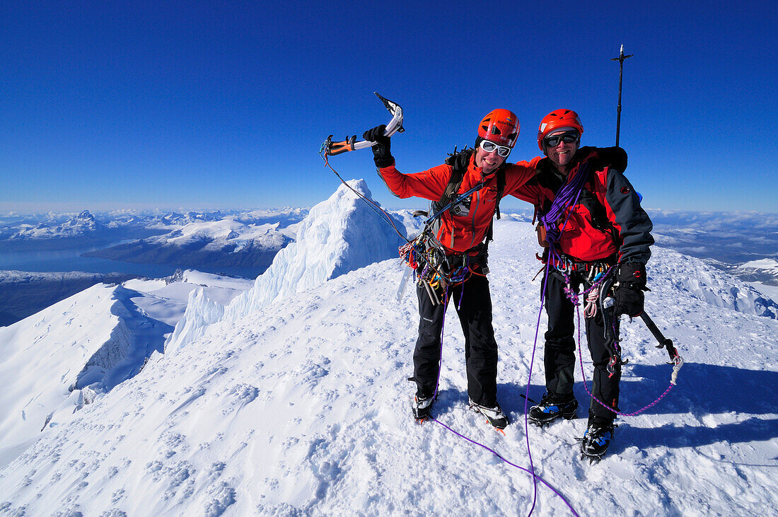 Two mountaineers at the west summit of Monte Sarmiento, Cordillera Darwin, Tierra del Fuego, Chile