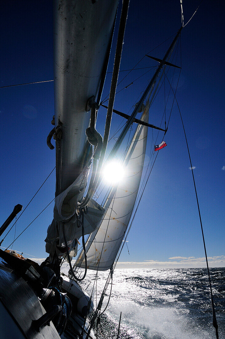 Sailing boat in rough sea, Strait of Magellan, Chile