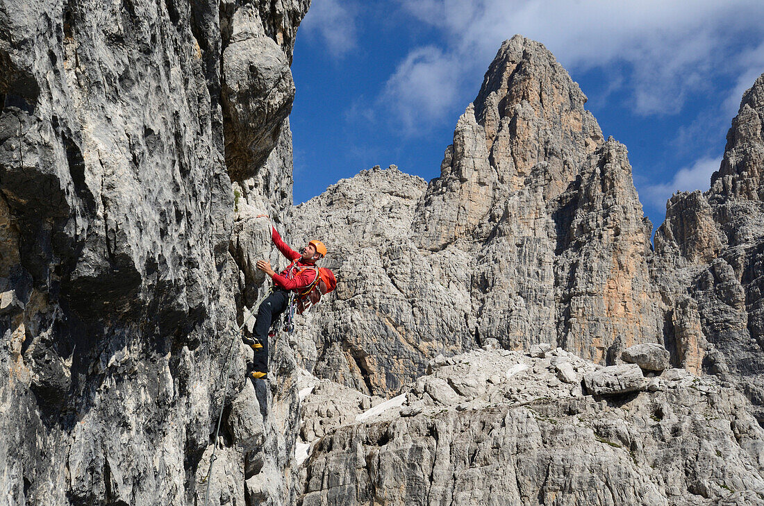 Climber ascending Detassis, Cima Brenta Alta, Dolomites, Trentino, Italy