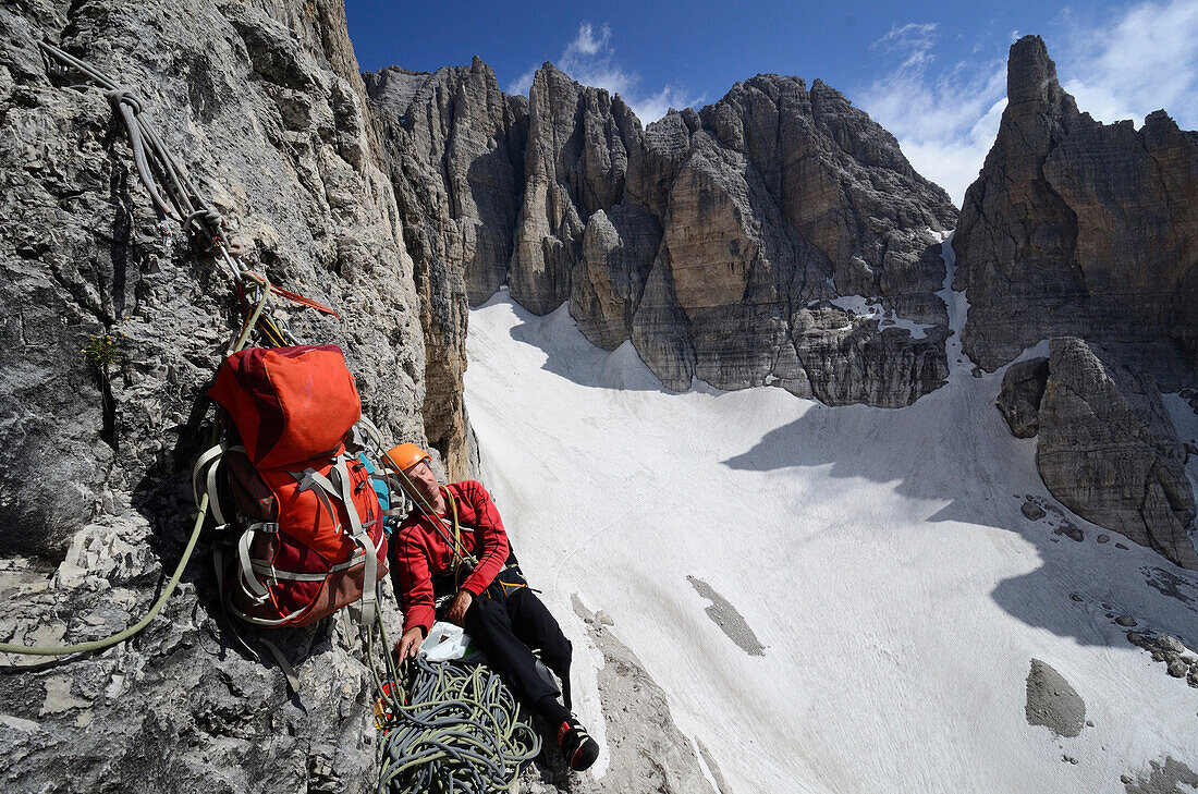 Cimber resting at belay, Soddisfazione, Cima d Ambiez, Brenta Dolomites, Trentino, Italien