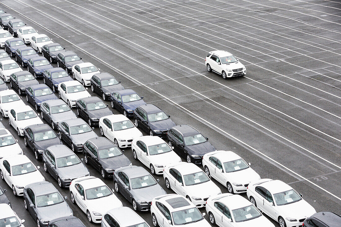 New cars on a parking area awaiting shipping in Bremerhaven, Germany