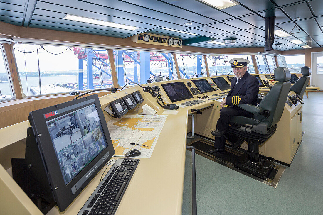 Captain Igor Sikic on the ship bridge, Burchardkai, Hamburg, Germany