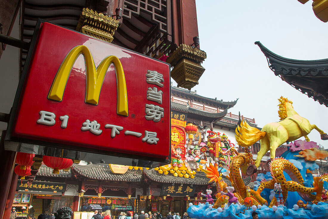 McDonald's sign and Chinese New Year decorations in the old town, Nanshi, Shanghai, China