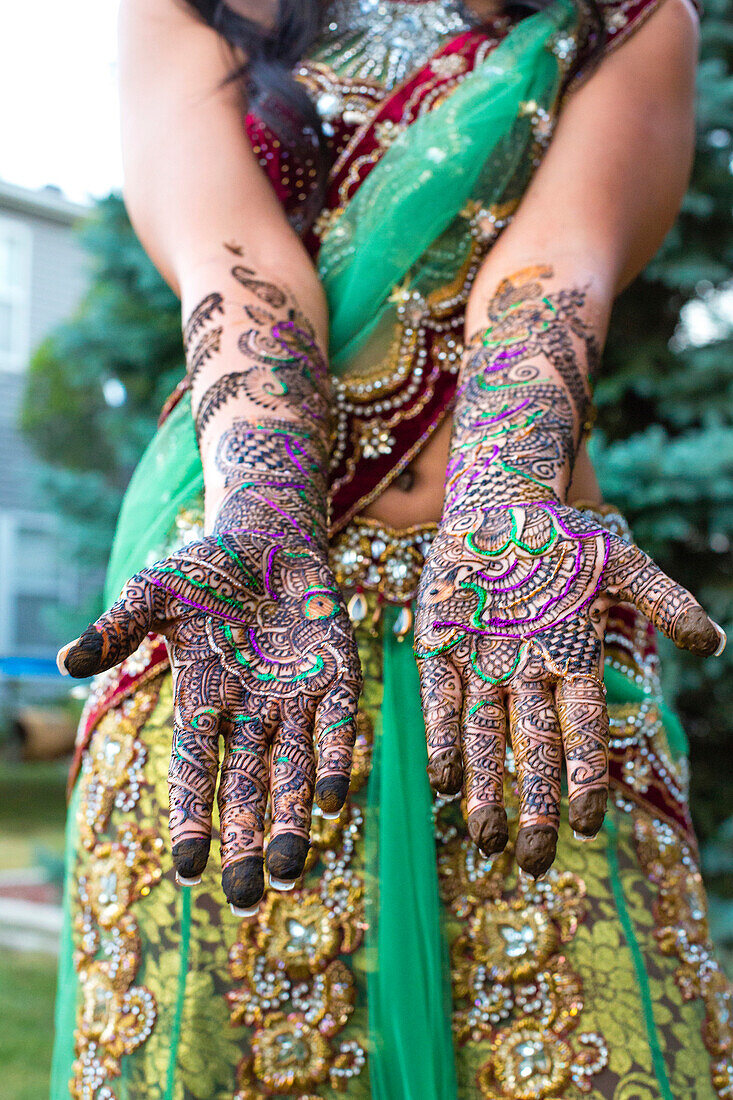 Close up of hands with intricate henna design, Chicago, Illinois, USA