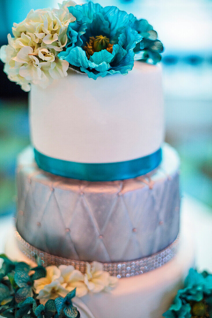 Blue and silver wedding cake with flowers, Chicago, Illinois, USA