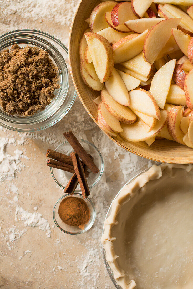 Close up of apples, spices and empty pie shell, Richmond, VA, USA