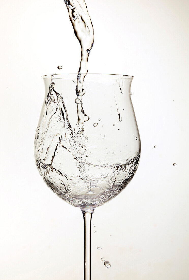 Water pouring into wine glass, milano, italy, lombardia