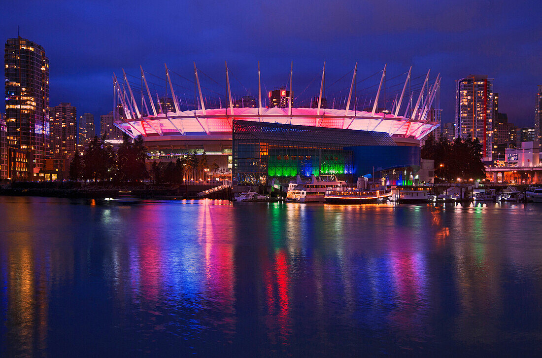 BC Place Stadium lit up at night on the Vancouver waterfront, Vancouver, British Columbia, Canada
