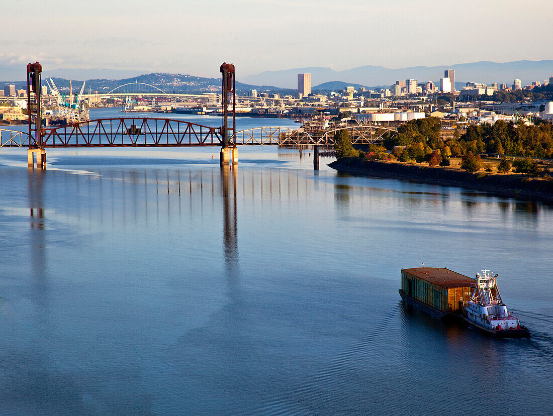 Tugboat Pushing Barge in River, Portland, Oregon, USA