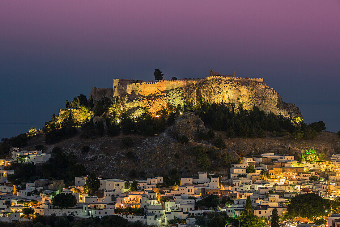 The acropolis above the small white houses of Lindos, Rhodes, Greece