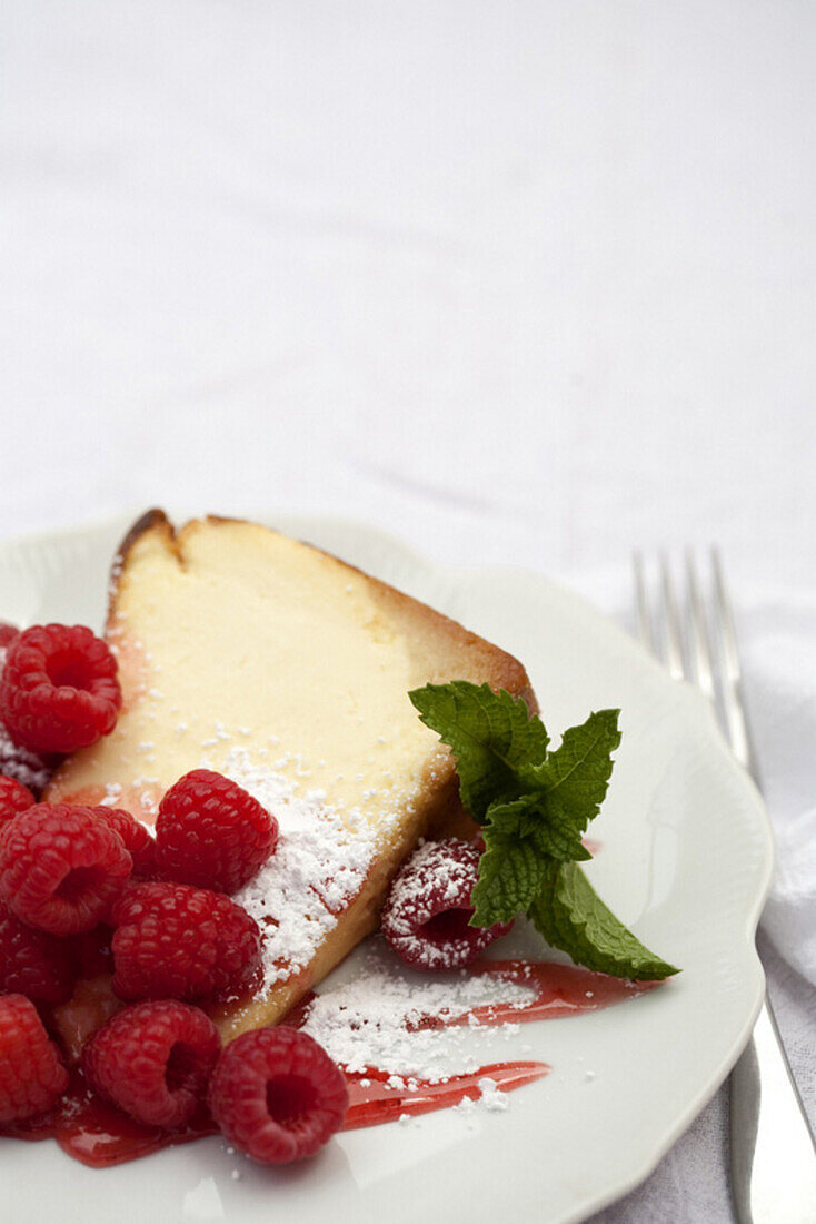 Close up of slice of cake with raspberries, Santa Fe, New Mexico, USA