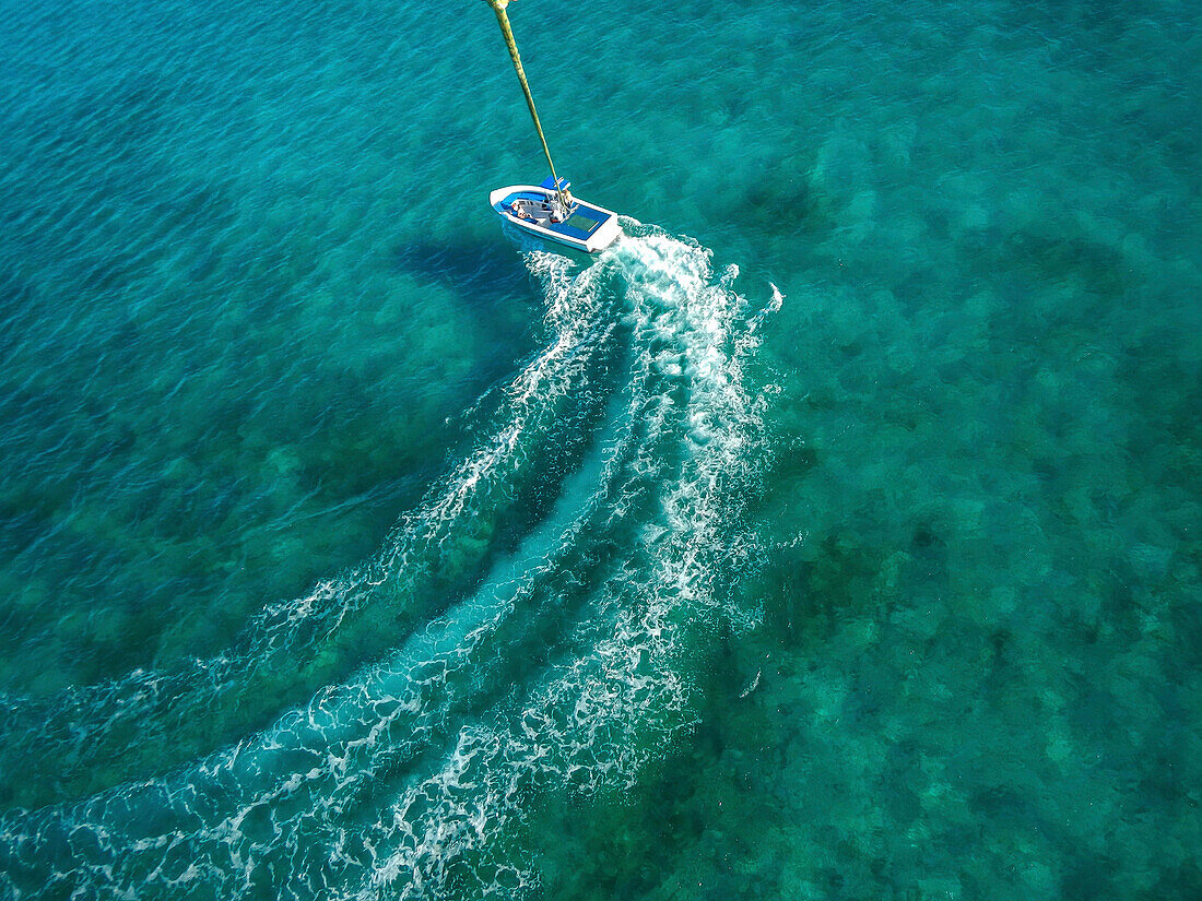 Speedboat turning in ocean, Carribean, Carribean, Carribean