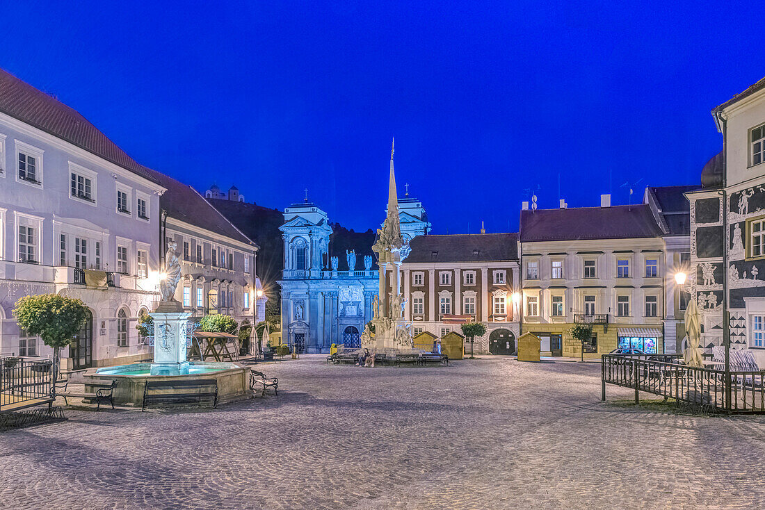 Illuminated piazza at dawn, Prague, Central Bohemia, Czech Republic, Prague, Central Bohemia, Czech Republic
