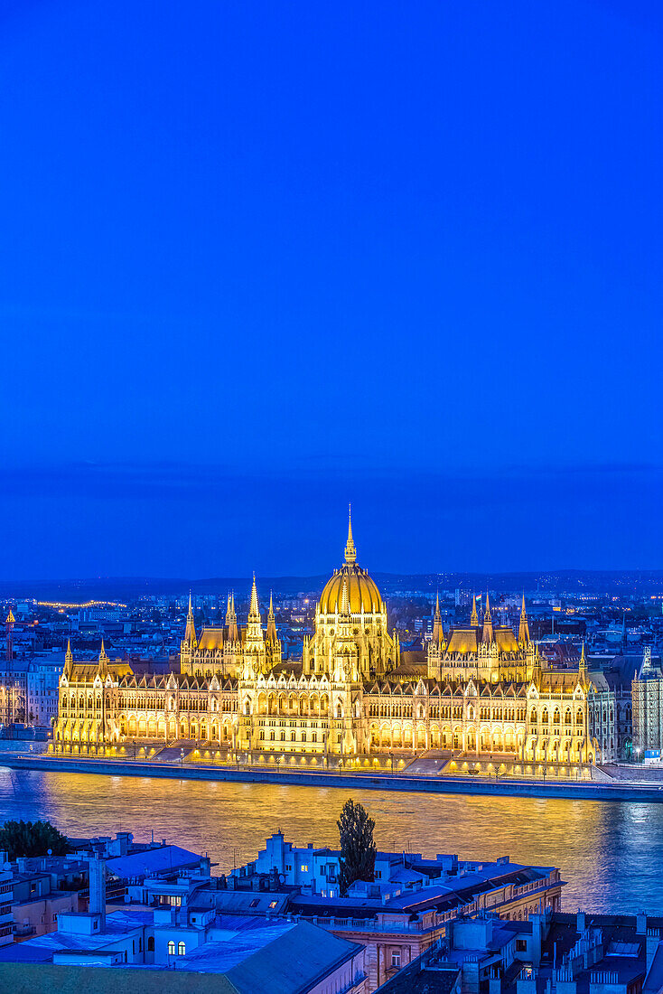 View of Parliament Building illuminated at dusk, Budapest, Hungary, Budapest, Central Hungary, Hungary