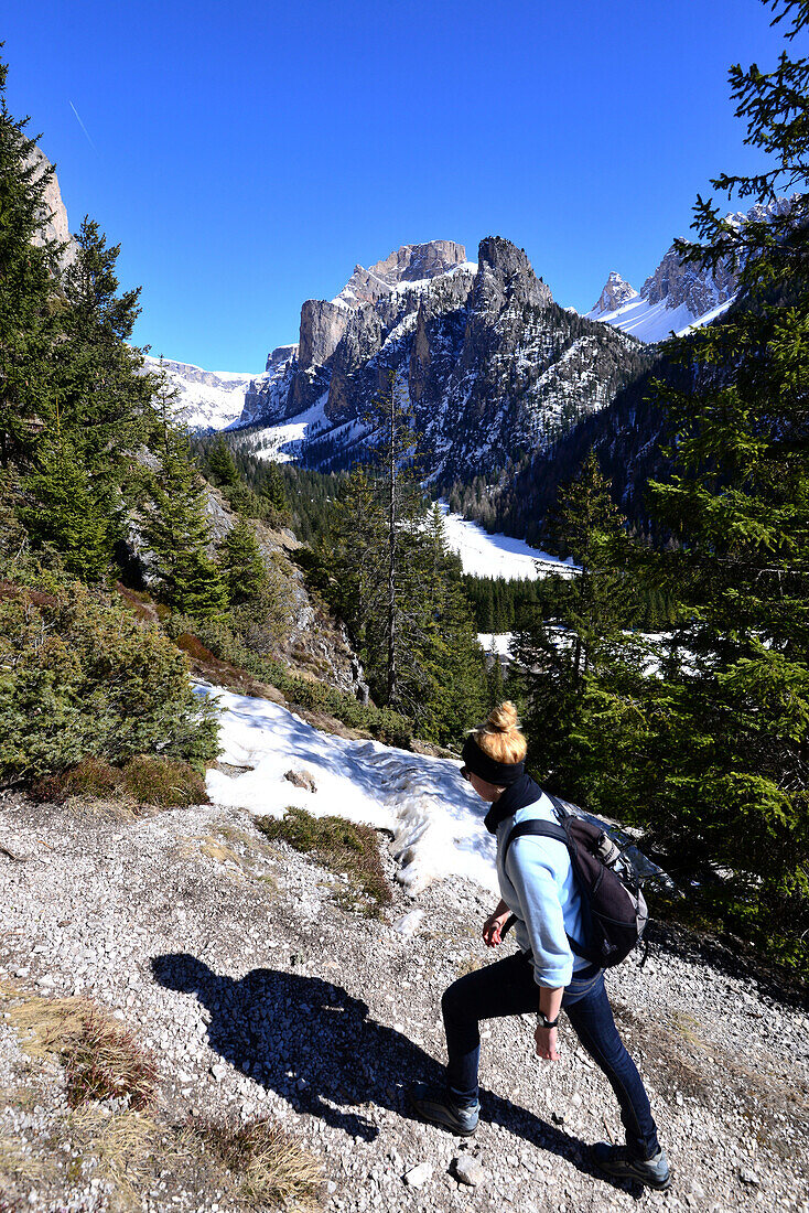 Hiking at Ciampac castle in Langen valley over Wolkenstein, Val Gardena, Groedner valley, Dolomites, South Tyrol, Italy