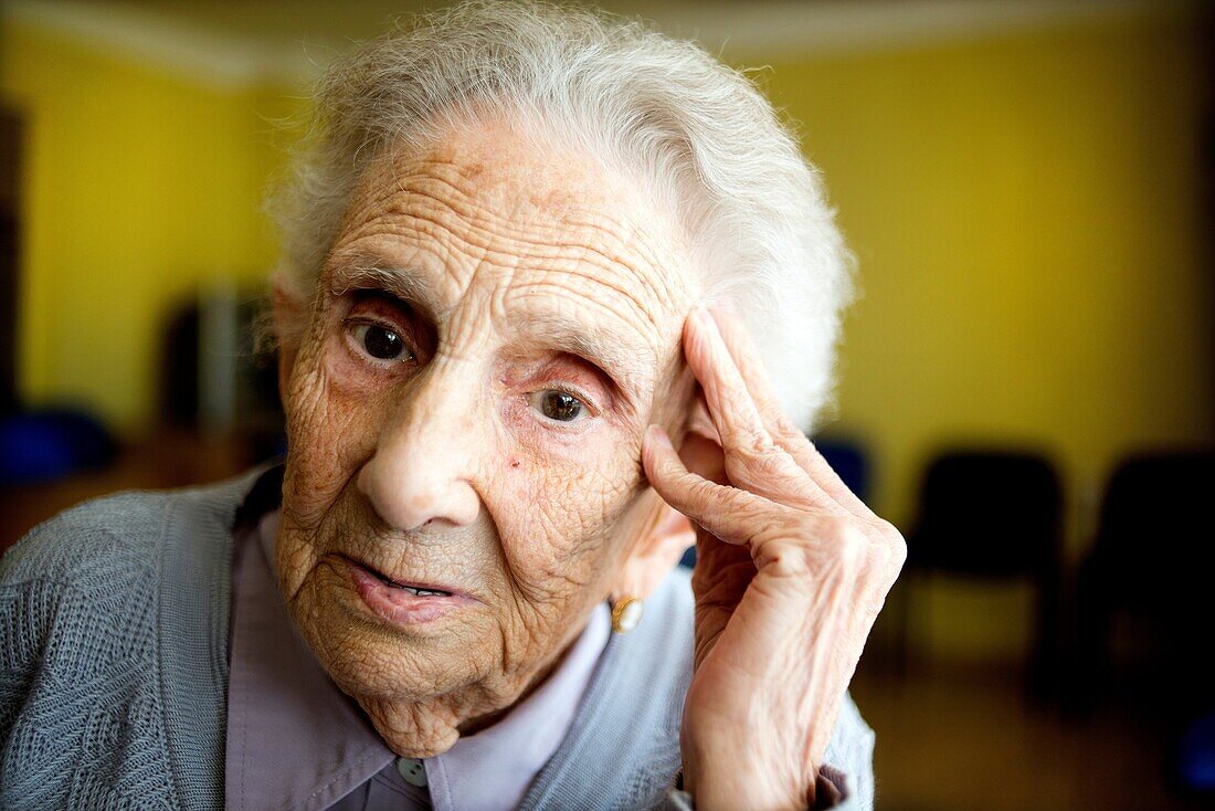 Portrait of a centennial woman in a elderly people home.