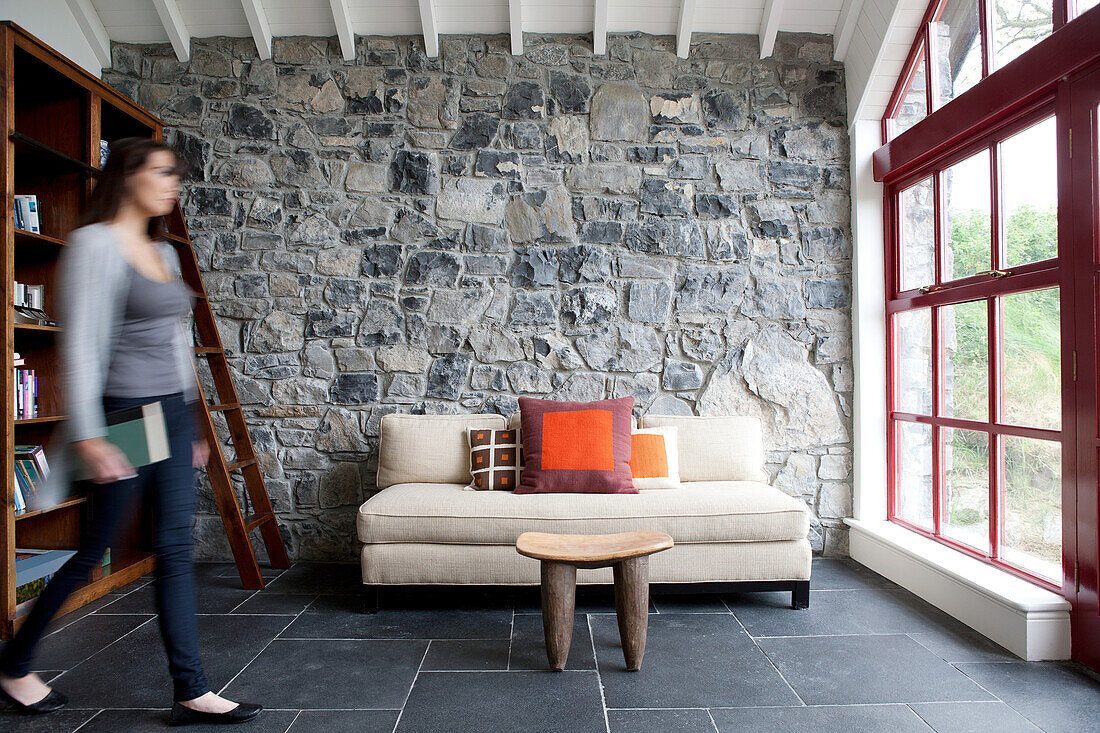 Woman entering living room