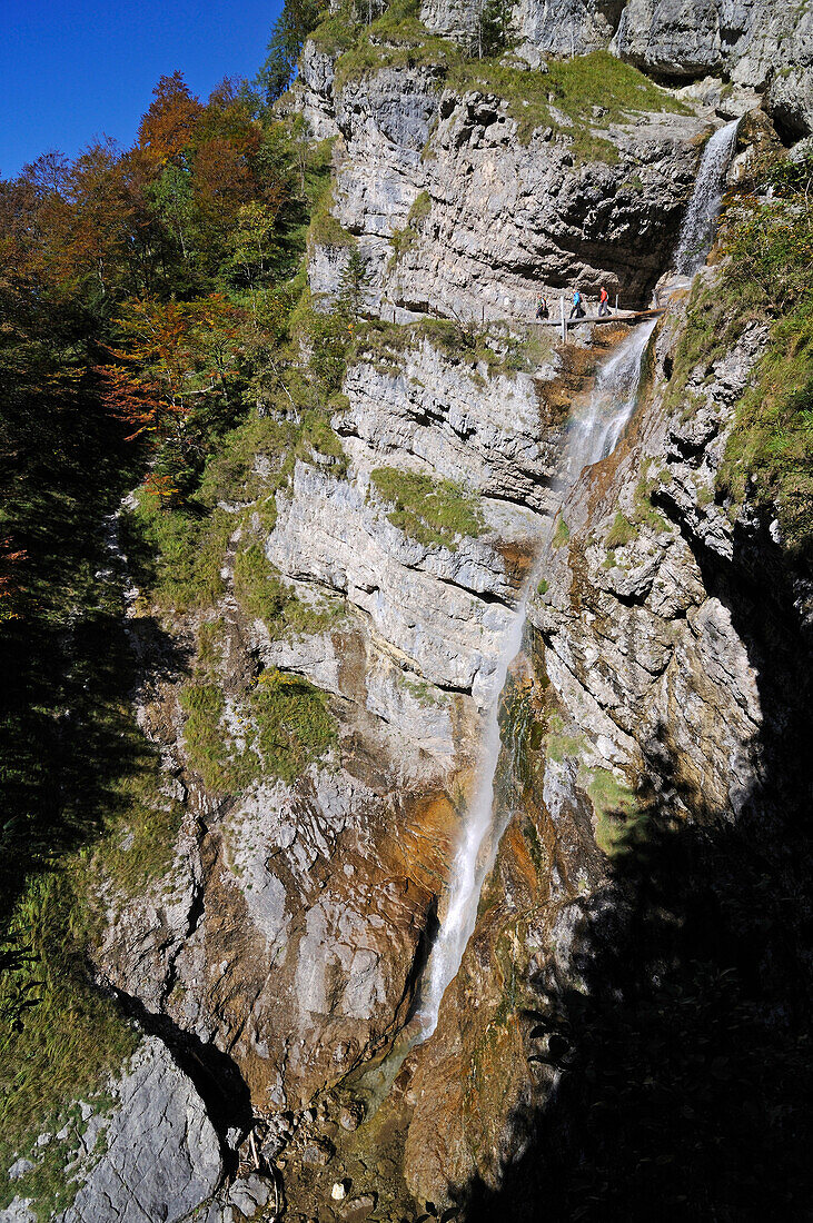 Female hikers passing Staubfall, Heutal, Unken, Salzburg, Austria, Ruhpolding, Chiemgau, Bavaria, Germany