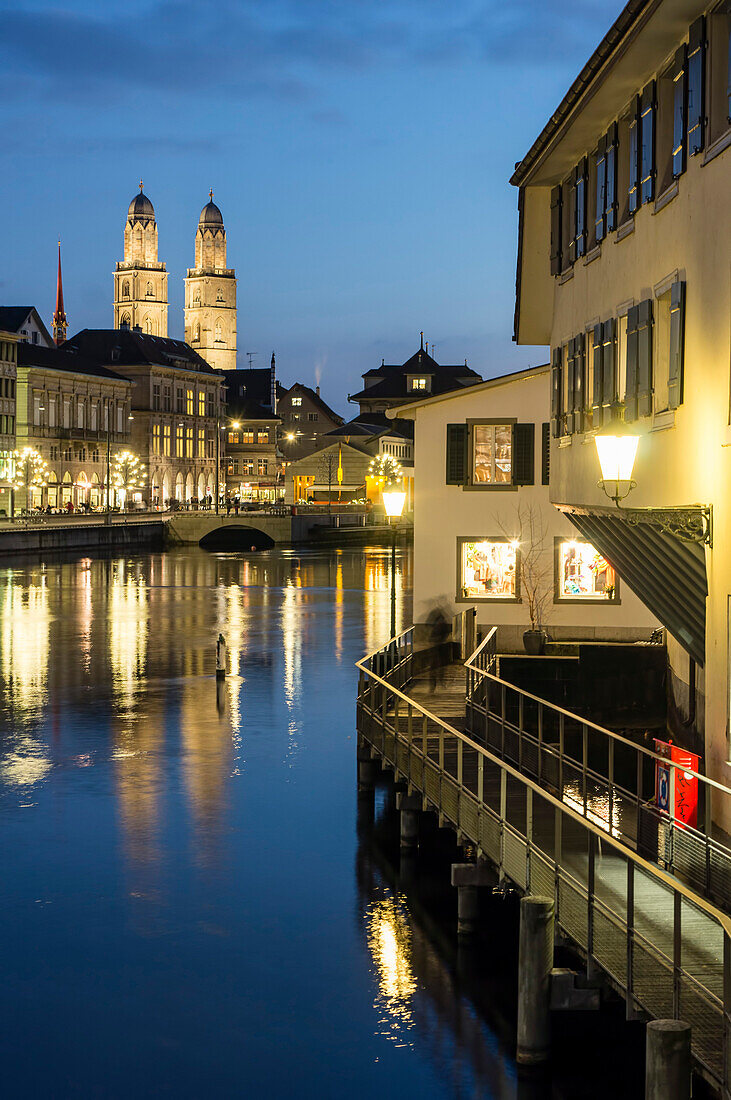 River Limmat and Grossmunster at dusk, Zurich, Switzerland