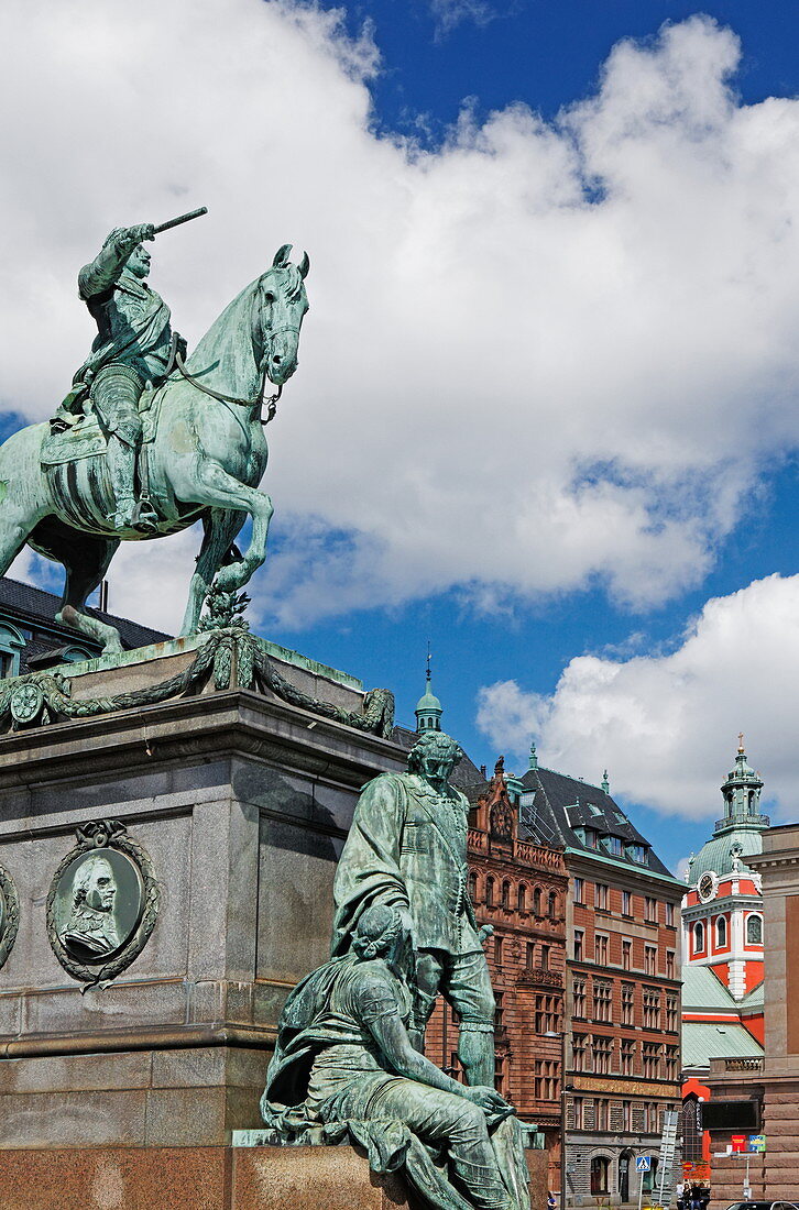 King Gustav Adolf II. at Gustaf-Adolf-Torg, with the steeple of Jacob's church in the background, Stockholm, Sweden