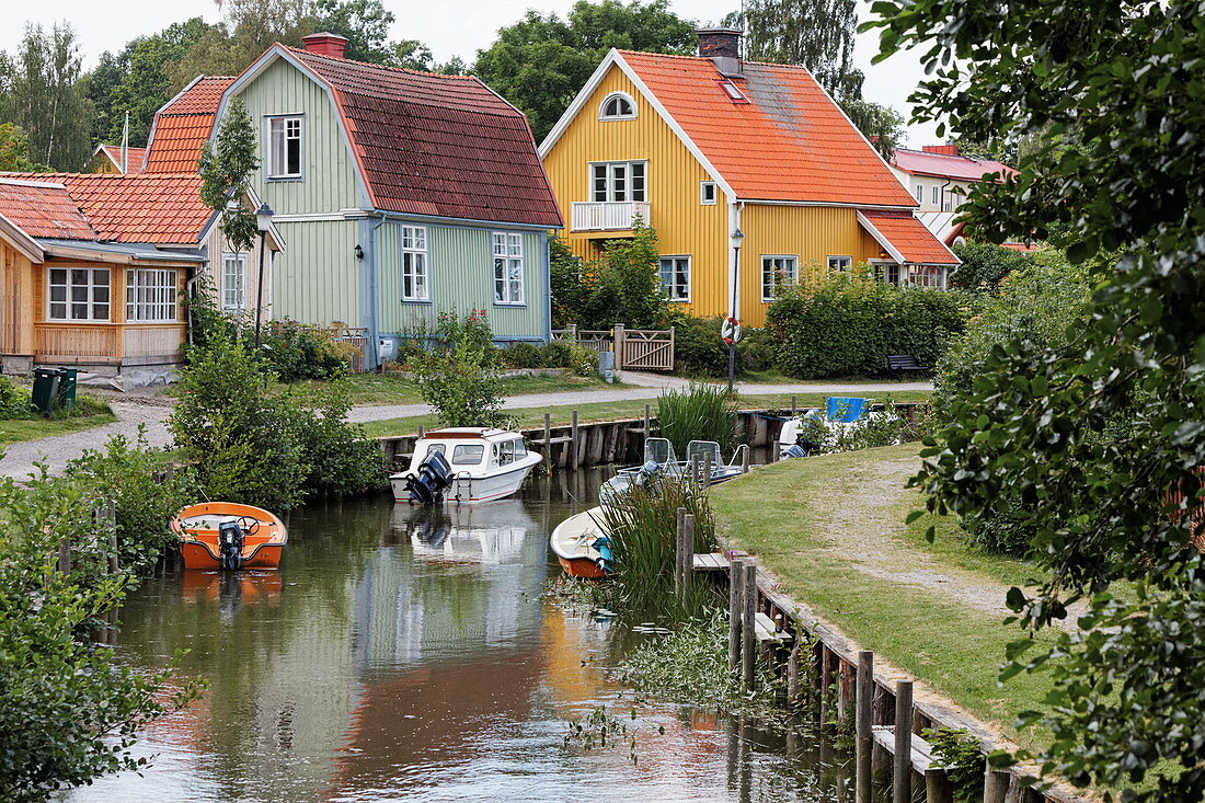Canal with typical wooden houses, Trosa, Sweden