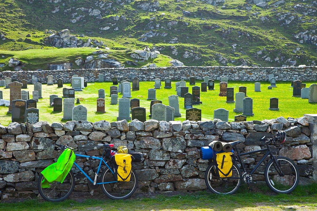 Cycling and cemetery nearby Bostadh Beach. Great Bernera. Lewis island. Outer Hebrides. Scotland, UK.