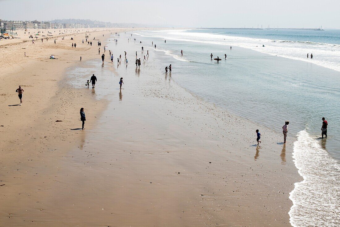 people walk on the beach at Venice Beach, California, USA