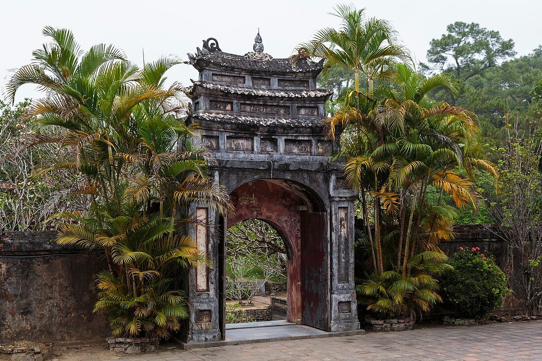 The Ming Mang Tomb complex of gates, buildings and statues near Hue, Vietnam, Asia.