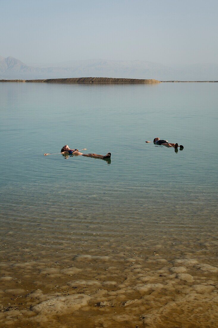 People floating at the Dead Sea, Israel.