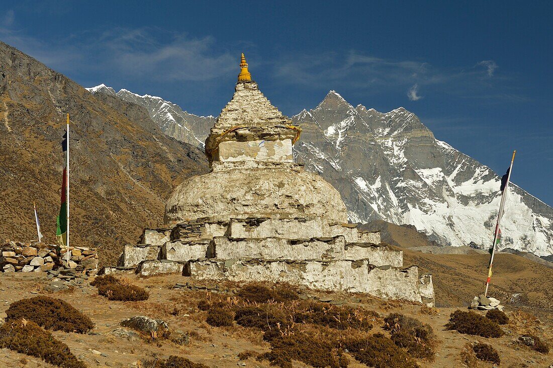 Chorten, little stupa, in Khumbu valley. Lhotse mountain (8501 m) in the background. Sagarmatha National Park (Nepal).