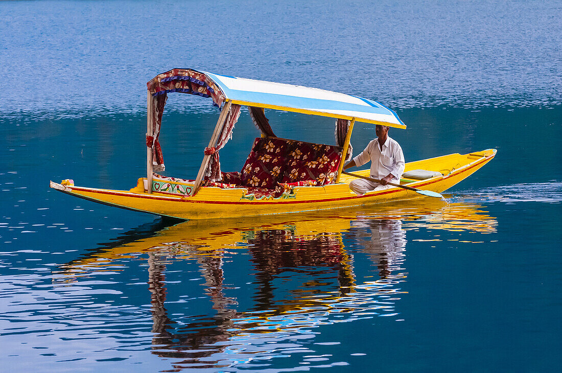 A shikara (boat) on Dal Lake in Srinagar, Kashmir, Jammu and Kashmir State, India.